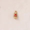 Detailed macro shot of a gold-plated 3D miniature lantern charm for custom jewelry DIY - Red Light
