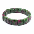 Close-up of faceted square ruby in zoisite stone bead bracelet on white background - Ruby Zoisite