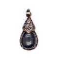 Macro view of a retro blue sandstone teardrop pendant with vintage copper filigree. - Blue Sandstone