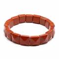 Detail showing the faceted square beads and texture of a red stone stretch bracelet - Red Jasper
