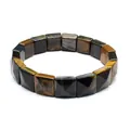 Detail view of natural tiger eye stone bracelet with faceted square beads on white background - Yellow Tiger Eye