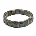 Macro shot of a faceted square unakite natural stone bead bracelet on white - Dragon Blood Stone