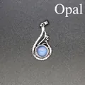 Elegant silver wave-shaped pendant necklace featuring a central round blue opal stone - Opal