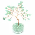 Close-up of a green natural stone crystal tree of life with copper wire branches - Aventurine Jade