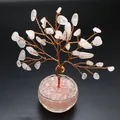Detailed shot of rose quartz crystal tree of life on copper wire with black background - Rose Quartz
