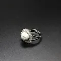 Adjustable silver-tone ring featuring a round white howlite stone and paved crystals - Howlite