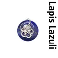 Pendentif donut en lapis-lazuli naturel avec détail de breloque papillon en argent - Lapis-lazuli