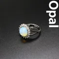 Elegant adjustable silver ring with milky white opal stone and sparkling zircon border - Opal