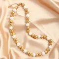 Detailed view of stainless steel gold bead and white faux pearl mixed beaded necklace - Gold White 10mm