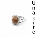 Adjustable silver ring featuring a round Unakite stone with CZ halo setting - Unakite
