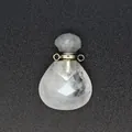 Macro detail view of faceted clear crystal teardrop perfume bottle pendant diffuser - White Crystal / Silver-Tone Accessories