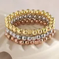 Juego de pulseras elásticas de cuentas de acero inoxidable chapado en oro de 18K. - Set de tres piezas