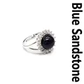 Elegant silver-tone blue sandstone adjustable ring with shimmering crystal halo setting. - Blue Sandstone
