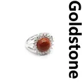 Adjustable silver halo ring featuring a round goldstone center and clear crystals - Gold Sandstone