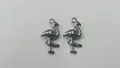 Close-up of high-quality stainless steel flamingo charms for DIY jewelry making - 19.1x9.8x4.15mm
