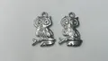 Detailed view of two silver stainless steel owl pendants for DIY jewelry making - 23.3x14.85x1.9mm