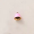 Close-up of a pink enamel bell pendant with gold-plated interior for DIY jewelry - Pink Bell