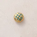 Close-up detail of a gold-plated stainless steel bead with blue quilted pattern. - Blue Round
