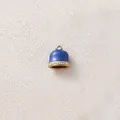 Close-up detail showing a blue enamel bell charm with gold plating and sparkling rhinestones. - Bell With Zirconia / Royal Blue Rhinestone Bell