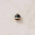 Detail view of a black enamel bell pendant with rhinestone band for DIY jewelry. - Black Bells with Rhinestones