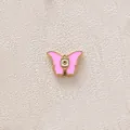 Pink enamel butterfly charm with gold plating and evil eye detail for DIY jewelry. - Butterfly / Pink