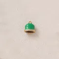 Close-up of green enamel bell pendant with crystal accents for DIY jewelry making - Green Bells with Rhinestones