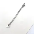 Close-up of a stainless steel jewelry extension chain with lobster clasp and S.Steel tag - Triangle Style (DN04-1) / 70mm Pack