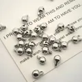 Macro view of several polished stainless steel jingle bells for pet collar accessories DIY - 5mm Bell / Steel