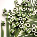 Close-up view of stainless steel wheel beads with inlaid green zircon stones. - 6.5*5*1.5mm (Aperture 3mm) / Steel