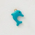 Close-up of teal blue enamel dolphin pendant with gold ring for DIY necklace and bracelet - Blue Dolphin