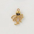 Close-up macro view of a gold-plated octopus pendant with black enamel eyes for jewelry - Octopus