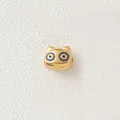 Macro view of a gold-plated stainless steel cartoon animal bead for DIY jewelry making. - Blue Big Eyed Pig (Style 8)