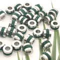 Close-up of stainless steel cylinder spacer beads with inlaid green crystals - 6.5*5*1.5mm (Aperture 3mm) / Steel