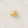 Close-up of a gold-plated stainless steel cartoon animal bead with yellow enamel eyes - Yellow Eyed Owl (Style 9)