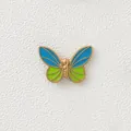 Detailed macro view of 18K gold plated butterfly bead with blue and green enamel - Blue Butterfly