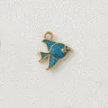 Close-up of golden tropical fish pendant with blue glitter for DIY jewelry accessory - Blue Goldfish