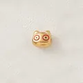 Close-up of gold-plated pig charm bead with red and black enamel eyes for DIY jewelry - Red Black Eyed Pig (Style 10)