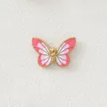 Macro detail of a 18K gold plated pink gradient butterfly charm for DIY jewelry - Pink Butterfly