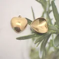 Detail showing front and back of golden stainless steel heart pendant for DIY jewelry. - 15*13.5*4mm / Gold