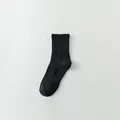 Classic solid black cotton mid-calf athletic sock featuring a ribbed cuff for comfort - Crew Socks / 1 Pair / Black