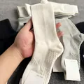 White crew socks for men with seamless knitting and ribbed cuff detail - Long Massage Sole / White