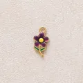 Elegant purple enamel flower charm pendant with gold metal frame and yellow center detail - Deep Purple Flower Pendant