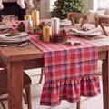 Festive red plaid table runner with ruffled edges on a rustic wooden dining table. - Double Ended Ruffles / 33-122cm / Christmas Red Plaid