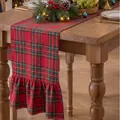 Close-up of red plaid Christmas table runner with ruffled edges on wooden table. - Double Ended Ruffles / 33x122cm / Large Plaid Red
