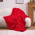 Luxurious red plush blanket featuring a carved heart pattern, elegantly draped on a white sofa - Red Heart Plush Blanket