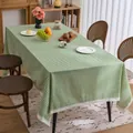 Green and white checkered tablecloth with delicate white lace trim in a dining setting - 60-60 / Green Checkered with Lace Trim