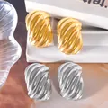 Premium metallic textured oval stud earrings set in both gold and silver plated finish - Spiral Wrinkled Oval Style (UB637) / One Pair / Steel