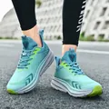 Lightweight breathable teal running shoes with lime green accents for outdoor jogging - Mist Green