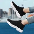 Breathable black knit sock sneakers with chunky white speckled sole for casual sports - 36 / Black and White