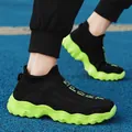 Breathable black fly-knit sock sneakers featuring a striking neon green wavy sole - 36 / Black Green